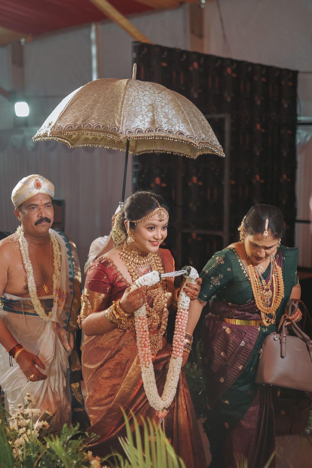 Ambika in procession with garland in hand