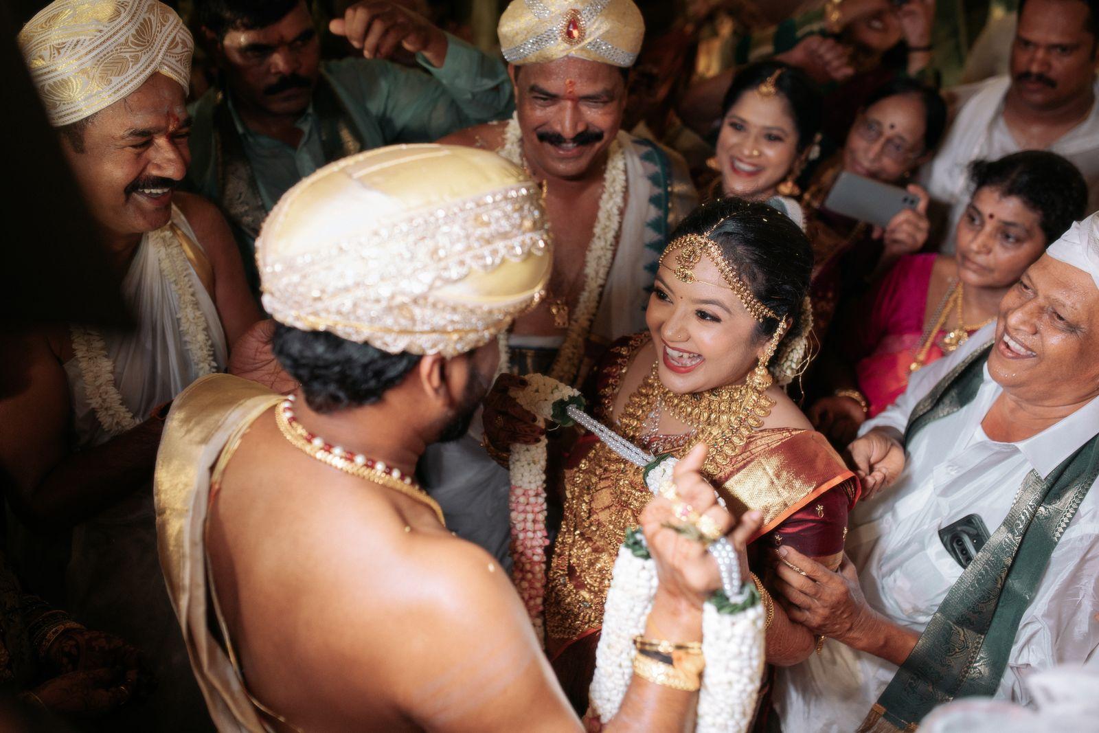 The couple amidst the gathered families