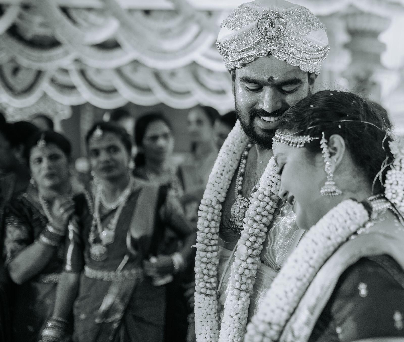 The couple laughing, in black and white