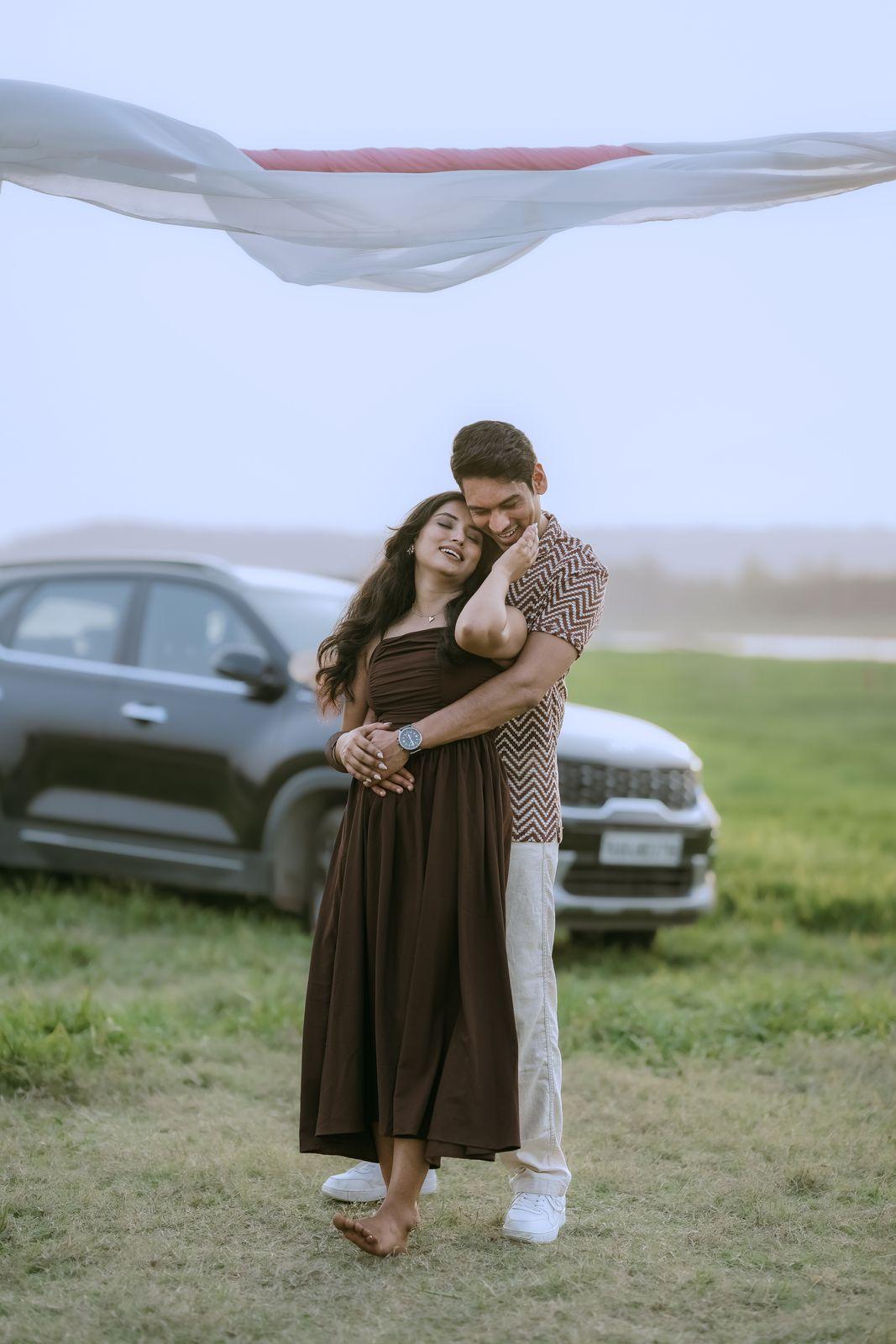 Rakshit holding Apeksha close in the misty field